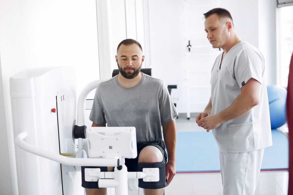 Doctor with a patient in physiotherapy clinic